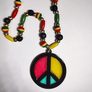 Reggae style wood beads and resin peace sign